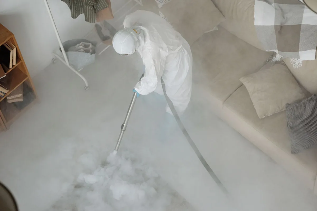 Biohazard cleanup technician in protective equipment, Tarpey Village, CA